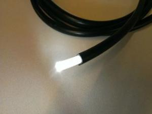 Sheathed end glow light guide